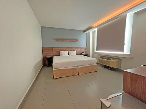 Кровать или кровати в номере Hotel El Sembrador