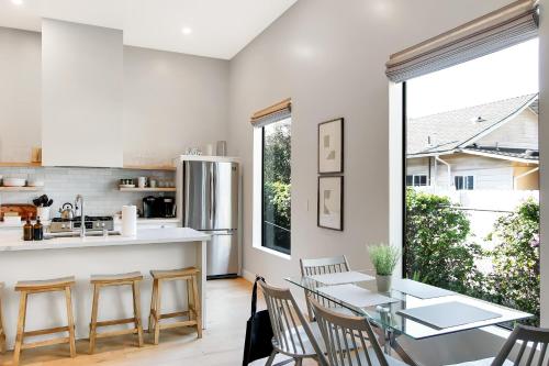 a kitchen and dining room with a table and chairs at Villa Castillo 5 in Santa Barbara