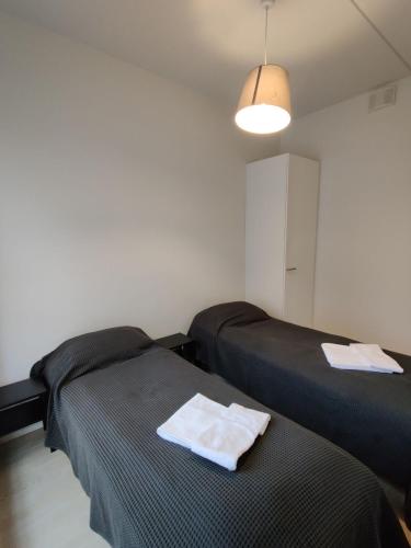 Krevet ili kreveti u jedinici u okviru objekta Comfortable new one-bedroom for 3. Airport/Tikkurila