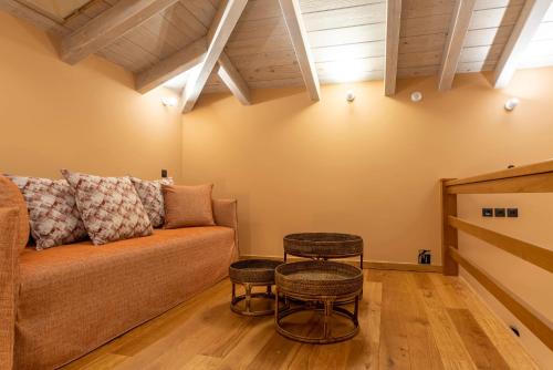 a living room with a couch and two tables at 5 Raches Suites in Arachova
