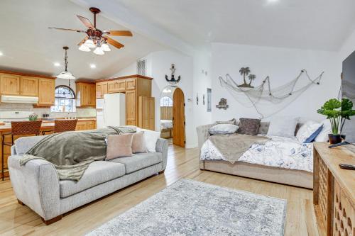 a living room with a couch and a kitchen at Canalfront Port Isabel Cottage 5 Mi to Beach! in Port Isabel