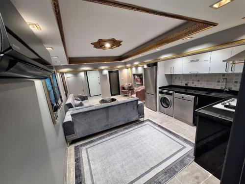 a large kitchen with a large tub in the middle at Cozy AKSARAY Apartment for 5 persons (Basement floor) in Istanbul