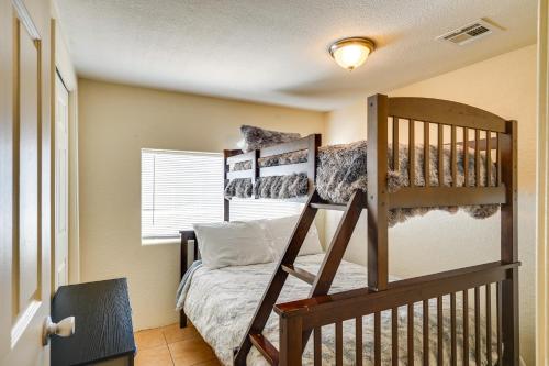 a bedroom with a bed and a bunk bed at Bright Bisbee Home about 6 Mi to Downtown! in Bisbee