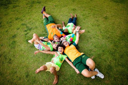 a group of people laying on the grass at Grande Hotel Termas de Araxá in Araxá