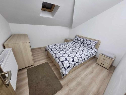 מיטה או מיטות בחדר ב-Dream House Caransebeș