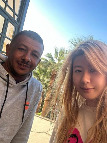 a man and a girl posing for a picture at ABAZIDO Nubian Guest House in Aswan