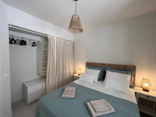 a bedroom with a bed with two towels on it at BLUE HORIZON Morro Jable in Morro del Jable