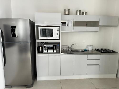 Imagen de la galería de Apartamento no Shopping Vesta, com piscina!, en Torres