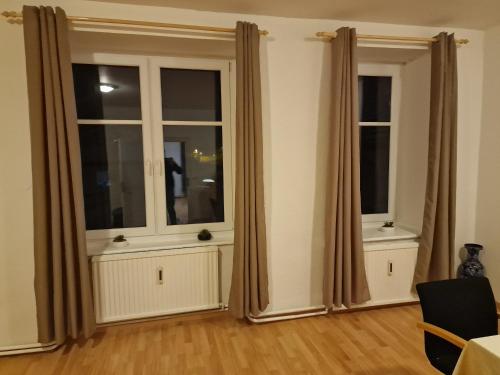 two windows in a living room with curtains at Gudzevic FU A - 5 in Gloggnitz