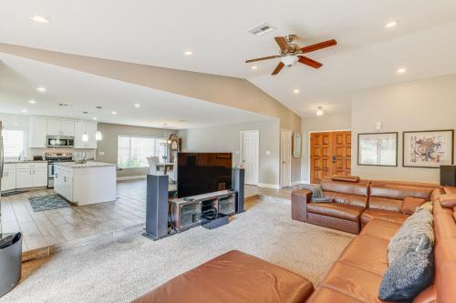 a living room with a couch and a kitchen at 12 Mi to Old Town! Home with Furnished Patio in Phoenix