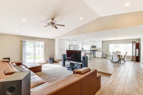 a living room with a couch and a tv at 12 Mi to Old Town! Home with Furnished Patio in Phoenix