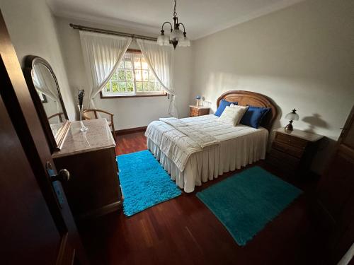 Un pat sau paturi într-o cameră la Oliveiras