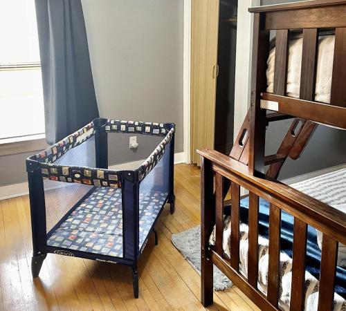 a room with a glass table next to a staircase at Spacious Home with In-Unit Laundry, Parking, 1GB WiFi, & Patio Deck in Rochester
