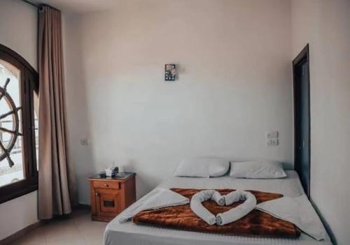 Postel nebo postele na pokoji v ubytování DownTown Hotel