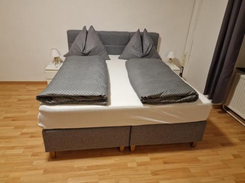 a bed with two pillows on it in a room at Gudzevic FU A - 5 in Gloggnitz