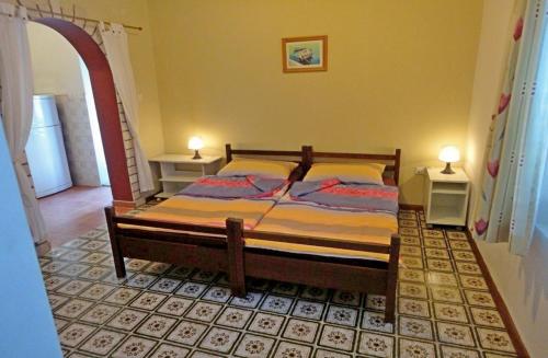 Postel nebo postele na pokoji v ubytování Holiday House Vis Pavic