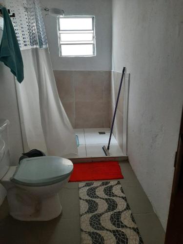 a bathroom with a toilet and a shower at Casa Paraty in Paraty