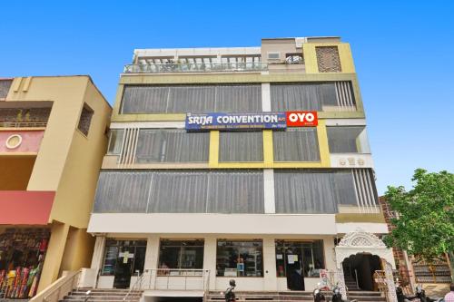 a building with a sign on the side of it at Super OYO Dk Reddy Square in Hyderabad