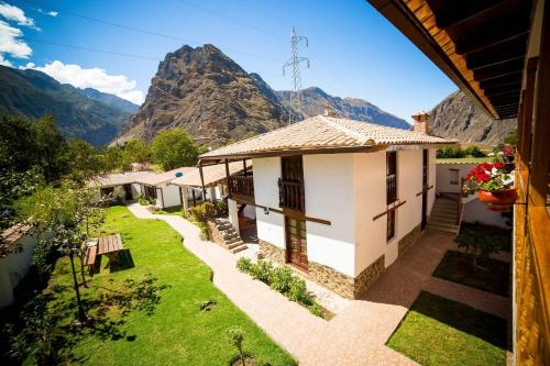 a house with a view of a mountain at Hotel Casablanca in Ollantaytambo