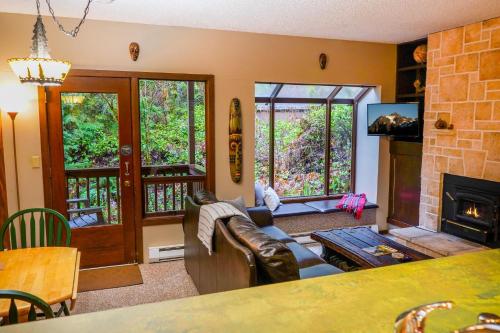 a living room with a couch and a fireplace at Snowater Nook in Deming