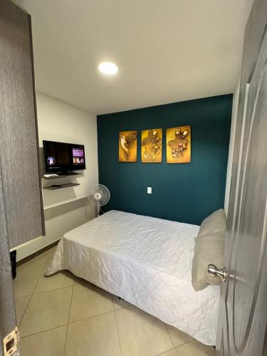 Katil atau katil-katil dalam bilik di APARTAMENTO AMOBLADO, LISTO PARA ESTRENAR.