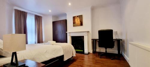 a bedroom with a bed and a television in it at Charming Victorian Property in Central London in London