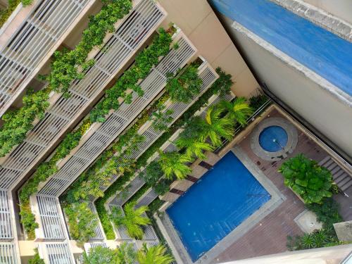 an overhead view of a pool at a resort at Rosecondotel in Manila