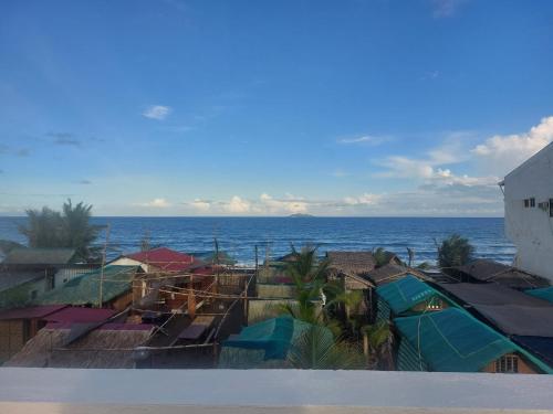 a view of the ocean from a beach at Kua's Pad Batangas Tent in Calatagan