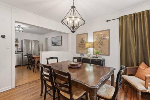a dining room and living room with a table and chairs at Tulsa Home Sweet Home - King Bed Near Expo, TU, Dtwn in Tulsa