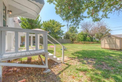 a porch of a house with a white railing at Tulsa Home Sweet Home - King Bed Near Expo, TU, Dtwn in Tulsa