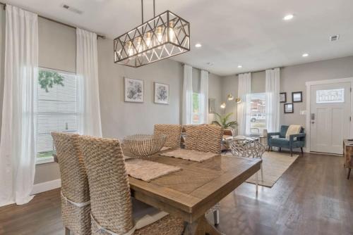 a dining room with a table and chairs at Tulsa Boho Bungalow - King Bed Near Dtwn, EXPO, TU in Tulsa