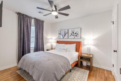 a bedroom with a bed and a ceiling fan at Trendy in Tulsa - King Bed Expo, TU, Downtown in Tulsa