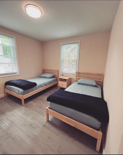 Ліжко або ліжка в номері Guest House Baltimore County Parkville