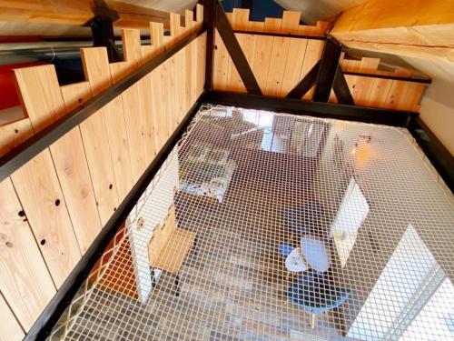 an inside view of a bird cage in a house at Loft industriel avec Spa, Sauna et Hammam en Touraine – Jardin clos et équipements haut de gamme - FR-1-381-559 in Marigny-Marmande