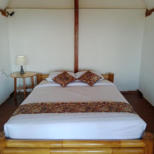 Postel nebo postele na pokoji v ubytování Bali jungle cabin