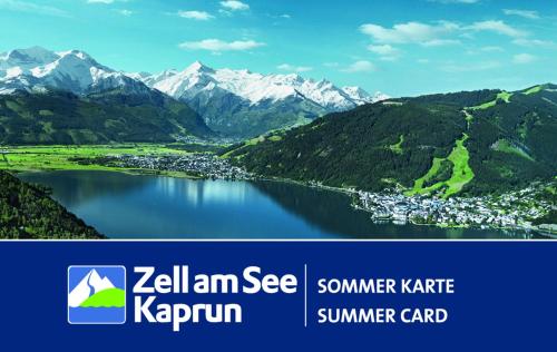 a picture of a lake with mountains in the background at Waterfront Apartments Zell am See - Steinbock Lodges in Zell am See