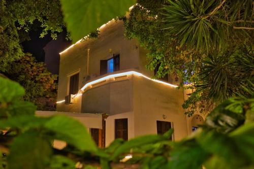 a building with lights on the side of it at Egyptus Villa Hostel in Alexandria