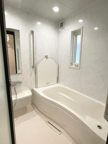 Ett badrum på 熊本民宿-悠然别苑