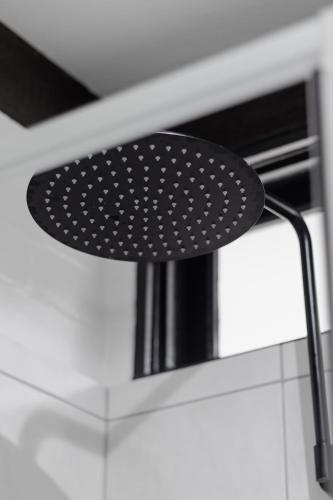 a black spatula sitting on top of a stove at m hotel in Sale