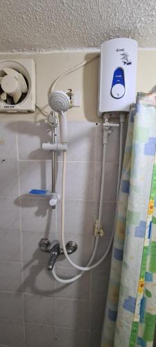 a bathroom with a blow dryer on the wall at Cambridge Village 