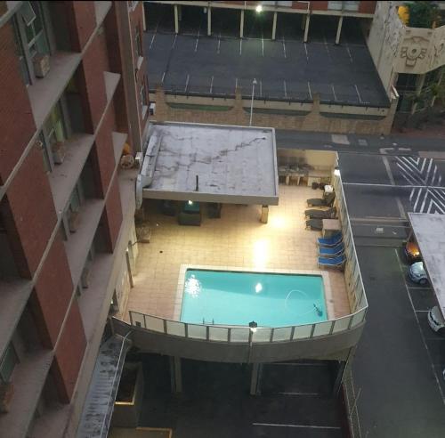 an overhead view of a swimming pool in a building at Oceanic,unit 124 ocean view in Durban
