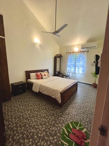 a bedroom with a large bed in a room at You are the key Villa in Anjuna