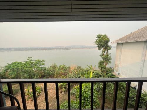 a view of the river from the balcony of a house at Siam Triangle Hotel Chiang Sean in Chiang Saen