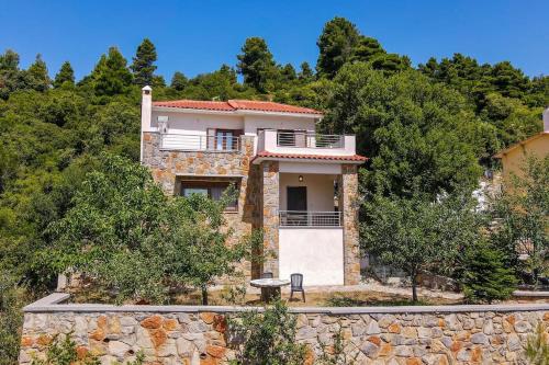 a house on top of a stone wall at Forest View House Seta in Séta