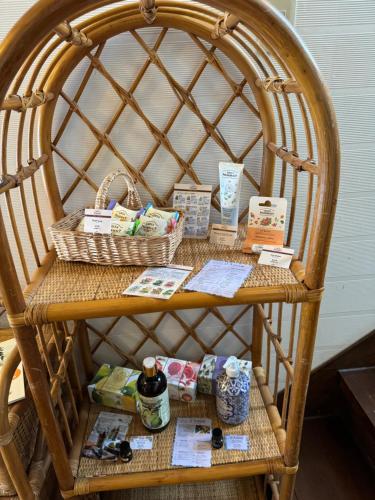 a wicker chair with baskets and medicines on it at ALBERGO DEL PESCATORE in Minamiaizu