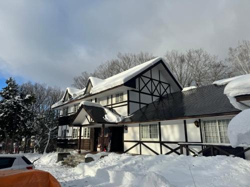 a house is covered in snow at ALBERGO DEL PESCATORE in Minamiaizu