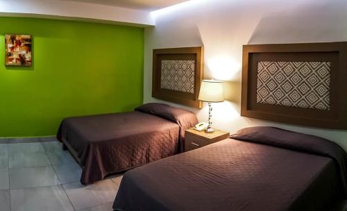 Postel nebo postele na pokoji v ubytování JM Express