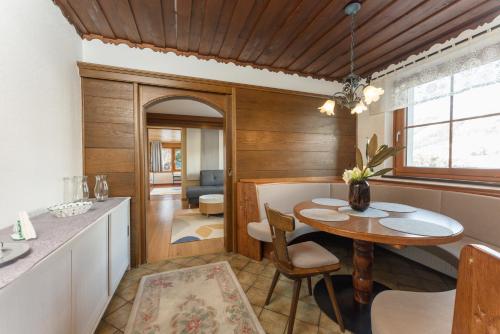 a kitchen and dining room with a table and chairs at Appartements Lettmayer by Schladming Appartements in Schladming
