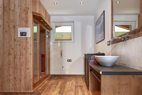 a bathroom with a counter with a bowl on it at Klammgut in Wagrain