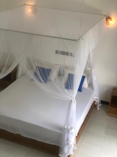 Postel nebo postele na pokoji v ubytování La Casa Mirissa